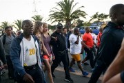 South African President Cyril Ramaphosa, center with black cap, goes for a walk with members of the public, Cape Town, South Africa, Feb. 20, 2018 (AP photo).