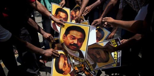 Supporters of Marumalarchi Dravida Munnetra Kazhagam, an Indian political party, burn portraits of  Sri Lankan President Mahinda Rajapaksa during a protest, New Delhi, India,  May 26, 2014 (AP photo by Tsering Topgyal).