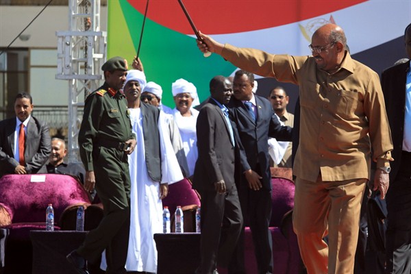 Sudanese President Omar al-Bashir greets his supporters at a rally in Khartoum, Sudan, Jan. 9, 2019 (AP photo by Mahmoud Hjaj).