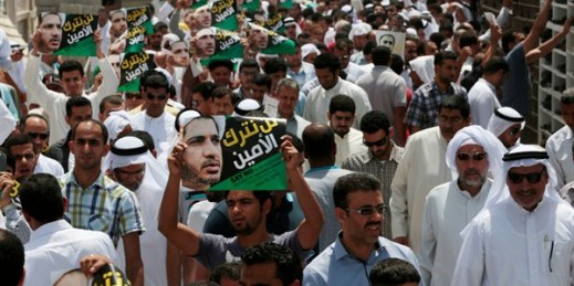 Bahraini Shiite Muslims march in support of prominent jailed opposition leader Sheikh Ali Salman after mid-day prayers in Diraz, Bahrain, June 12, 2015 (AP photo by Hasan Jamali).