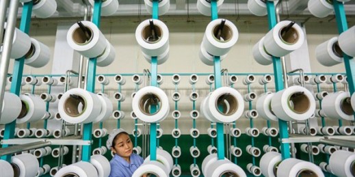 A woman works in a weaving factory in Jinjiang, in southeast China’s Fujian province, Nov. 22, 2018 (Chinatopix photo via AP Images).