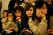 Chinese students listen to a speech at Chongqing University, Dec. 20, 2007 (Photo by Andrew Parsons for Press Association via AP Images).