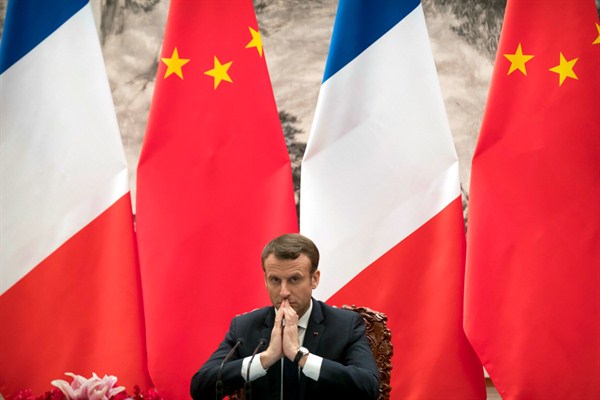 French President Emmanuel Macron watches a signing ceremony between French and Chinese firms at the Great Hall of the People in Beijing, Jan. 9, 2018 (AP photo by Mark Schiefelbein).