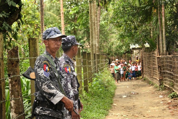 Myanmar Border Guard Police officers stand guard at a village street in northern Buthidaung township, Rakhine state, Myanmar, July 13, 2017 (AP photo by Esther Htusan).