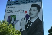 A poster for the Chinese smartphone manufacturer Huawei on a high-rise building in Warsaw, Poland, May 23, 2018 (Photo by Natalie Skrzypczak for dpa via AP Images).