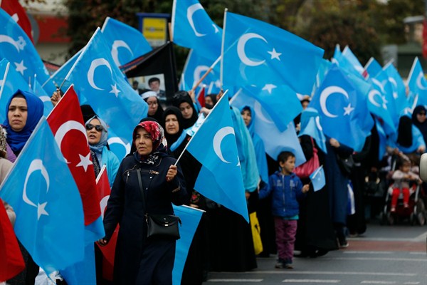 People from the Uighur community in Turkey carry flags of what ethnic Uighurs call ‘East Turkestan,’ during a protest in Istanbul, Nov. 6, 2018 (AP photo by Lefteris Pitarakis).