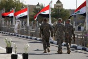 U.S. soldiers leave Al Faw palace at Camp Victory in Baghdad, Iraq, Dec. 1, 2011 (AP photo by Khalid Mohammed).