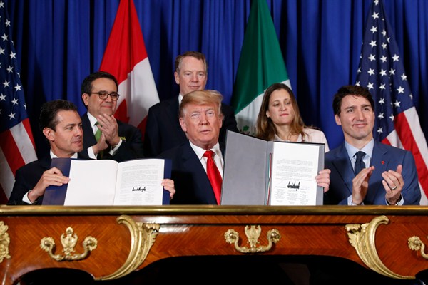 U.S. President Donald Trump, Canadian Prime Minister Justin Trudeau and Mexican President Enrique Pena Nieto at the USMCA signing ceremony in Buenos Aires, Argentina, Nov. 30, 2018 (AP photo by Pablo Martinez Monsivais).