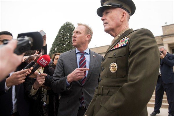 Acting Secretary of Defense Patrick Shanahan, center, and Chairman of the Joint Chiefs of Staff Gen. Joseph Dunford, right, talk to the press at the Pentagon in Washington, Feb. 22, 2019 (AP photo by Kevin Wolf).