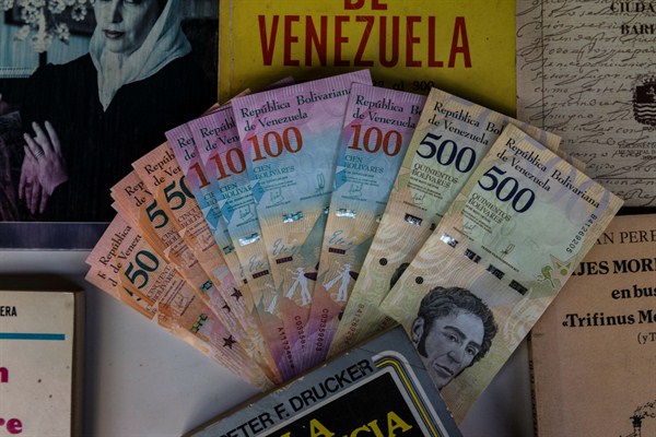 Venezuelan Bolivar bills arranged on a table in a bookshop in Caracas, Venezuela, Jan. 28, 2019 (DPA photo by Marcelo Perez del Carpio via AP Images).