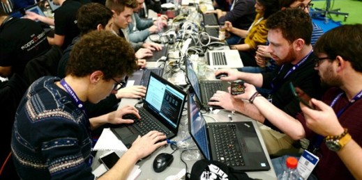 Cybersecurity experts take part in a test at a conference in Lille, France, Jan. 22, 2019 (AP photo by Michel Spingler).