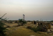 View of the Kutadi Bandar with the Tata Mundra power plant in the background, Mundra, India, Oct. 8, 2014 (flickr photo by Sami Siva).