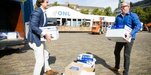 Thierry Baudet, left, and Jan Roos deliver a petition calling for the public to have a say on ties between the European Union and Ukraine, The Hague, Netherlands, Sept. 10, 2015 (Photo by Jaap Arriens for Sipa via AP Images).