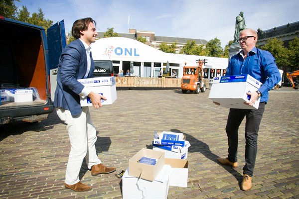 Thierry Baudet, left, and Jan Roos deliver a petition calling for the public to have a say on ties between the European Union and Ukraine, The Hague, Netherlands, Sept. 10, 2015 (Photo by Jaap Arriens for Sipa via AP Images).