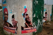 Torn posters of Nigerian President Muhammadu Buhari in Abuja, Nigeria, Feb. 24, 2019 (AP photo by Jerome Delay).