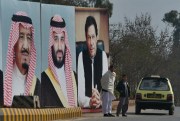 Portraits of Saudi King Salman, Crown Prince Mohammed bin Salman and Pakistani Prime Minister Imran Khan line a highway outside Islamabad ahead of the crown prince's visit to tout Saudi investment in Pakistan, Feb. 17, 2019 (AP photo by Anjum Naveed).