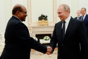 Russian President Vladimir Putin and Sudanese President Omar al-Bashir, in Moscow, July 14, 2018 (Photo by Sergey Mamontov for Sputnik via AP Images).