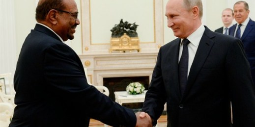 Russian President Vladimir Putin and Sudanese President Omar al-Bashir, in Moscow, July 14, 2018 (Photo by Sergey Mamontov for Sputnik via AP Images).