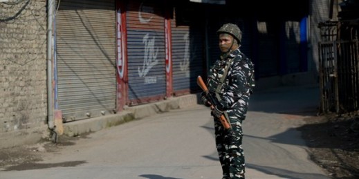 An Indian paramilitary soldier stands guard outside a closed market in Srinagar, Indian-controlled Kashmir, Feb. 28, 2019 (AP photo by Dar Yasin).