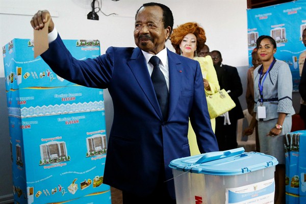 Cameroon’s president, Paul Biya, casts his vote during the presidential elections in Yaounde, Cameroon, Oct. 7, 2018 (AP photo by Sunday Alamba).