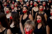 Women take part in an International Women’s Day march in Santiago, Chile, March 8, 2019 (AP photo by Esteban Felix).