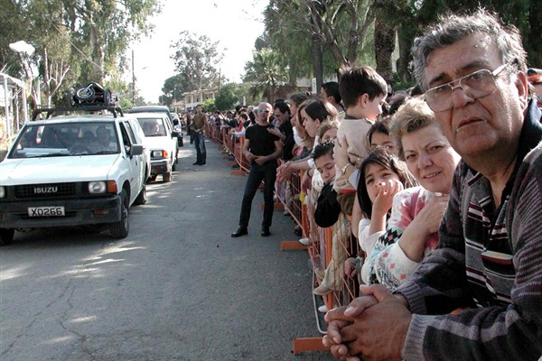 Greek Cypriots wait at a checkpoint to cross into the Turkish part of Nicosia, April 27, 2003 (Photo by Mustafa Sagiroglu for Anatolia via AP Images).