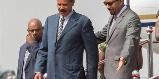 Eritrean President Isaias Afwerki, left, is welcomed by Ethiopian Prime Minister Abiy Ahmed upon his arrival at Addis Ababa International Airport, Ethiopia, July 14, 2018 (AP photo by Mulugeta Ayene).
