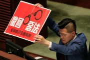 Pro-democracy lawmaker Gary Fan displays a sign reading “Withdraw bad law” to protest the extradition law during a Legislative Council session, Hong Kong, April 3, 2019 (AP photo by Vincent Yu).