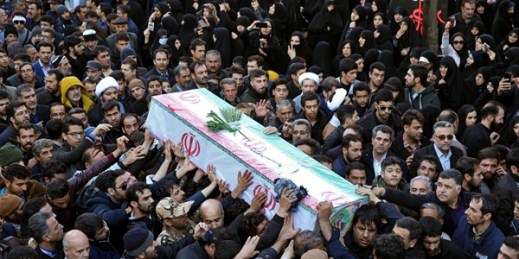 Mourners carry a flag-draped casket during a mass funeral for those killed in a suicide car bombing that targeted members of Iran’s powerful Revolutionary Guard, in Isfahan, Iran, Feb. 16, 2019 (AP photo by Ebrahim Noroozi).