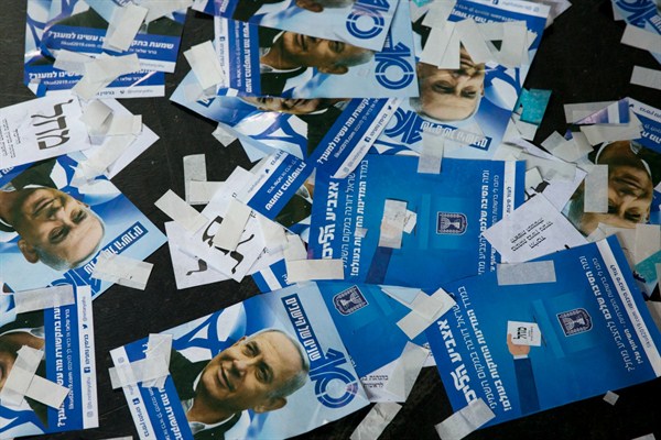 Likud party ballot papers and Israeli Prime Minister Benjamin Netanyahu’s campaign fliers on the ground after polls closed in Tel Aviv, Israel, April 10, 2019 (AP photo by Ariel Schalit).