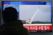 A man watches a TV news program showing footage of a North Korean missile launch, Seoul, South Korea, March 3, 2016 (AP photo by Ahn Young-joon).