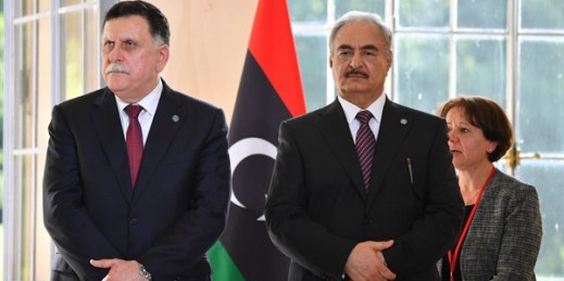 Libyan Prime Minister Fayez al-Sarraj, left, and Gen. Khalifa Haftar, commander of the Libyan National Army, at a press conference in La Celle-Saint-Cloud, near Paris, France, July 25, 2017 (Photo by Christian Liewig for Sipa via AP Images).