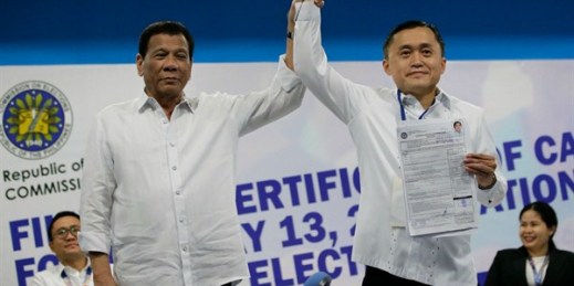 Philippine President Rodrigo Duterte, left, with his aide, Christopher “Bong” Go, who is a senatorial candidate in next month’s midterm elections, in Manila, Philippines, Oct. 15, 2018 (AP photo by Aaron Favila).
