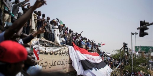 Sudanese demonstrators gather outside the Defense Ministry a day after the military took power and arrested President Omar al-Bashir, Khartoum, Sudan, April 12, 2019 (Photo by Ala Kheir for dpa via AP Images).