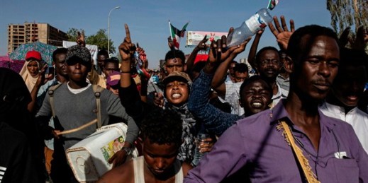 Demonstrators rally near the military headquarters in Khartoum, Sudan, April 15, 2019 (AP photo by Salih Basheer).