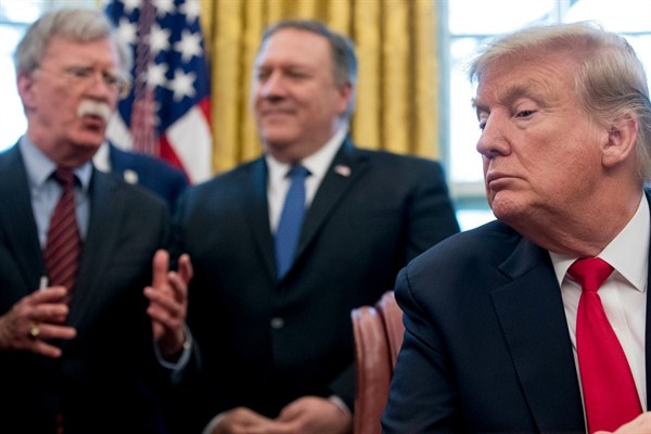 National Security Adviser John Bolton, Secretary of State Mike Pompeo and President Donald Trump in the Oval Office of the White House, Washington, Feb. 7, 2019 (AP photo by Andrew Harnik).