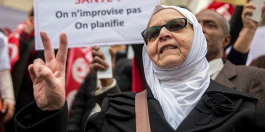 A woman attends a demonstration to celebrate Tunisia’s independence, Tunis, March 20, 2019 (AP photo by Hassene Dridi).
