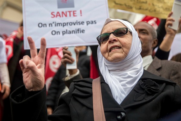 A woman attends a demonstration to celebrate Tunisia’s independence, Tunis, March 20, 2019 (AP photo by Hassene Dridi).