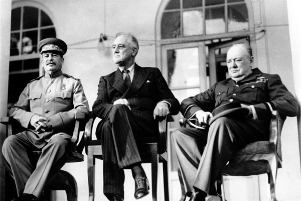 Soviet Union Premier Joseph Stalin, U.S. President Franklin D. Roosevelt and British Prime Minister Winston Churchill at the Tehran Conference, Iran, Nov. 28, 1943 (British Official Photo via AP Images).