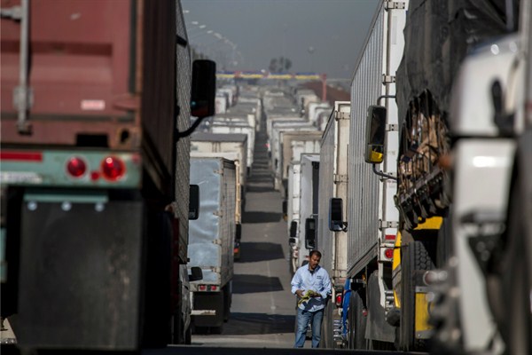 Trucks lined up at the Otay border crossing between Mexico and the United States, Otay, Mexico, April 11, 2019 (DPA photo by Omar Martinez via AP Images).