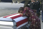 Myeshia Johnson cries over the casket of her husband, Sgt. La David Johnson, who was killed in an assault in Niger, Miami, Oct. 17, 2017 (WPLG via AP).