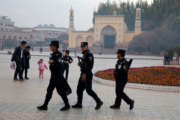 Uighur security personnel patrol near the Id Kah Mosque in Kashgar in western China’s Xinjiang region, Nov. 4, 2017 (AP photo by Ng Han Guan).