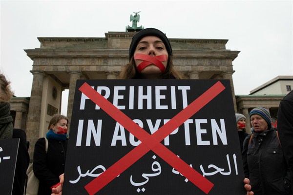 Amnesty International activists protest against human rights violations in Egypt and for freedom of expression on the sidelines of the Egyptian president’s visit to Berlin, Germany, Oct. 29, 2018 (Photo by Paul Zinken for dpa via AP Images).