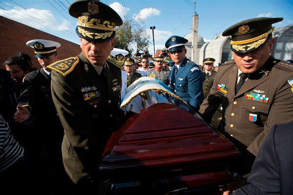 Guatemalan military officers carry the coffin of former dictator Efrain Rios Montt to his burial site at a cemetery in Guatemala City, April 1, 2018 (AP photo by Moises Castillo).