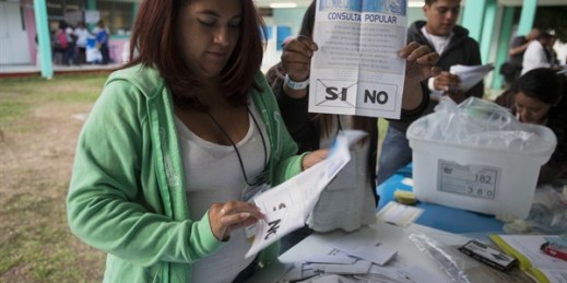 An electoral worker shows a ballot marked “yes” during a referendum concerning a border dispute with Belize, in Guatemala City, April 15, 2018 (AP photo by Moises Castillo).