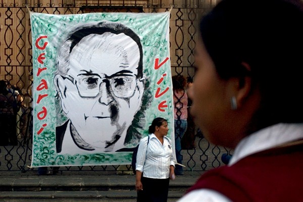 A banner depicting slain Guatemalan Bishop Juan Jose Gerardi at a rally to mark the 12th anniversary of his murder in Guatemala City, April 26, 2010 (AP photo by Moises Castillo).