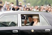 Japanese Emperor Naruhito and Empress Masako on their way to the Imperial Palace in Tokyo, May 1, 2019 (Kyodo photo via AP Images).