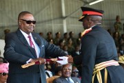 Malawian President Peter Mutharika, left, is presented with the Sword of Command by the Malawi Defense Force Commander General Griffin Phiri, right, during an inauguration ceremony in Blantyre, Malawi, May 31, 2019 (AP photo by Thoko Chikondi).