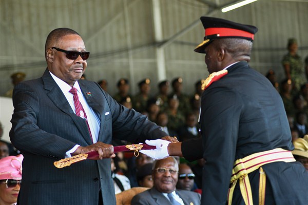 Malawian President Peter Mutharika, left, is presented with the Sword of Command by the Malawi Defense Force Commander General Griffin Phiri, right, during an inauguration ceremony in Blantyre, Malawi, May 31, 2019 (AP photo by Thoko Chikondi).