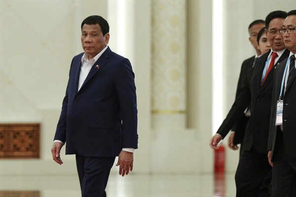 Philippine President Rodrigo Duterte, left, arrives for a meeting at the Great Hall of the People in Beijing, China, April 25, 2019 (Photo by Kenzaburo Fukuhara for Kyodo via AP Images).
